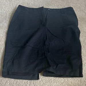 Black skirt with cut out detail in the back and button pockets in the back